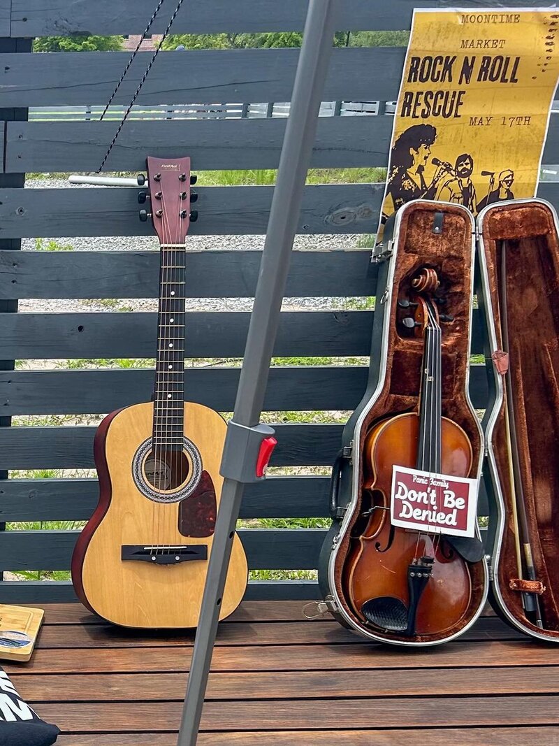 Kids receiving musical instruments at a Rock n Roll Rescue donation drive